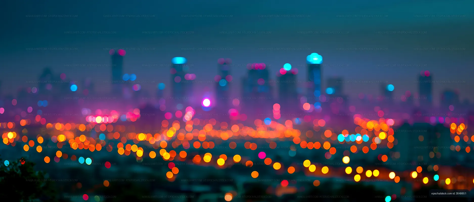City skyline at night with bright lights and blurred effect