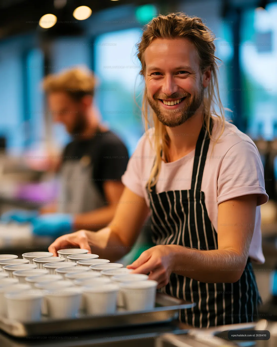 Barista serving coffee cups in a busy cafe