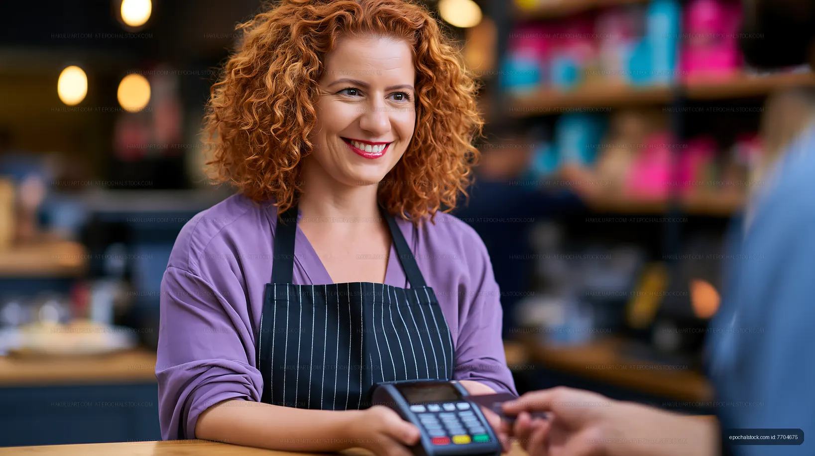 Cashier serving customer at cafe with card payment