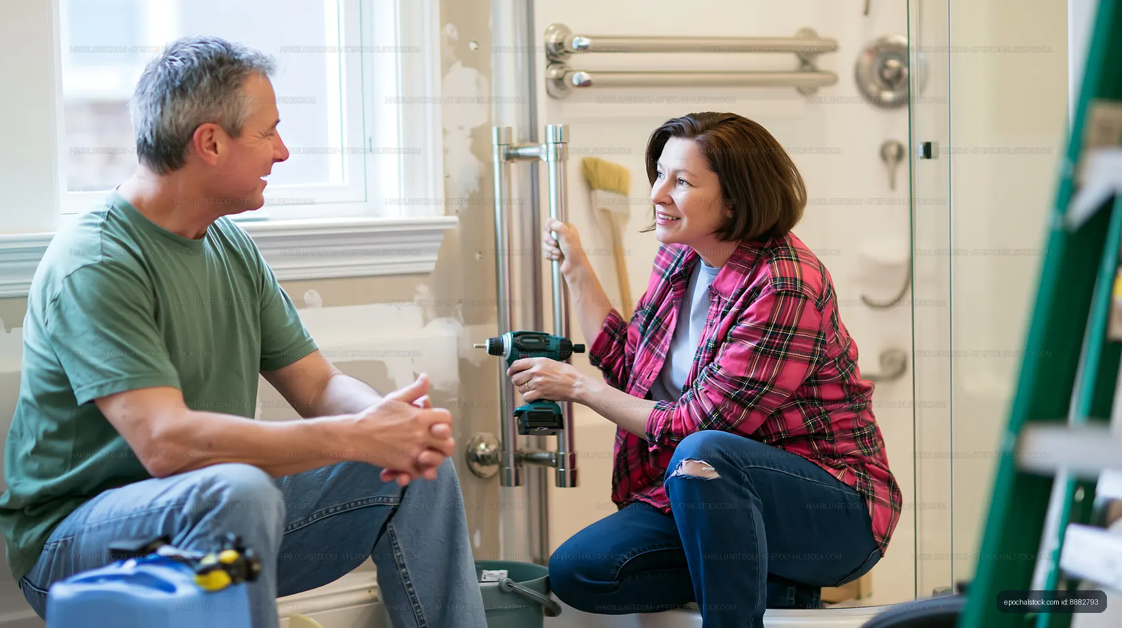 Couple working together on home renovation in bathroom