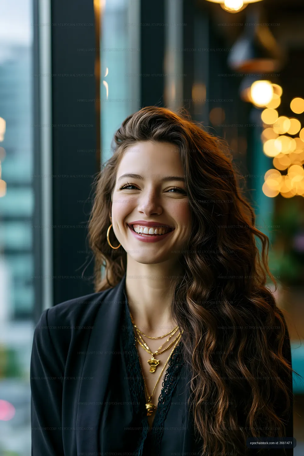 Portrait of a woman smiling by a large window in a cafe
