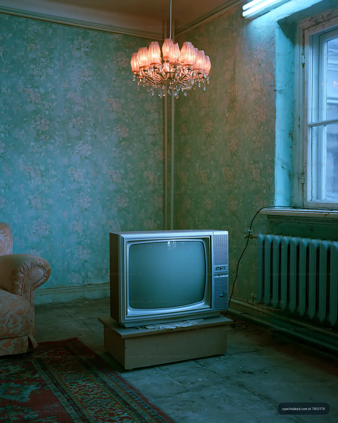 Old television set in a vintage room with a chandelier