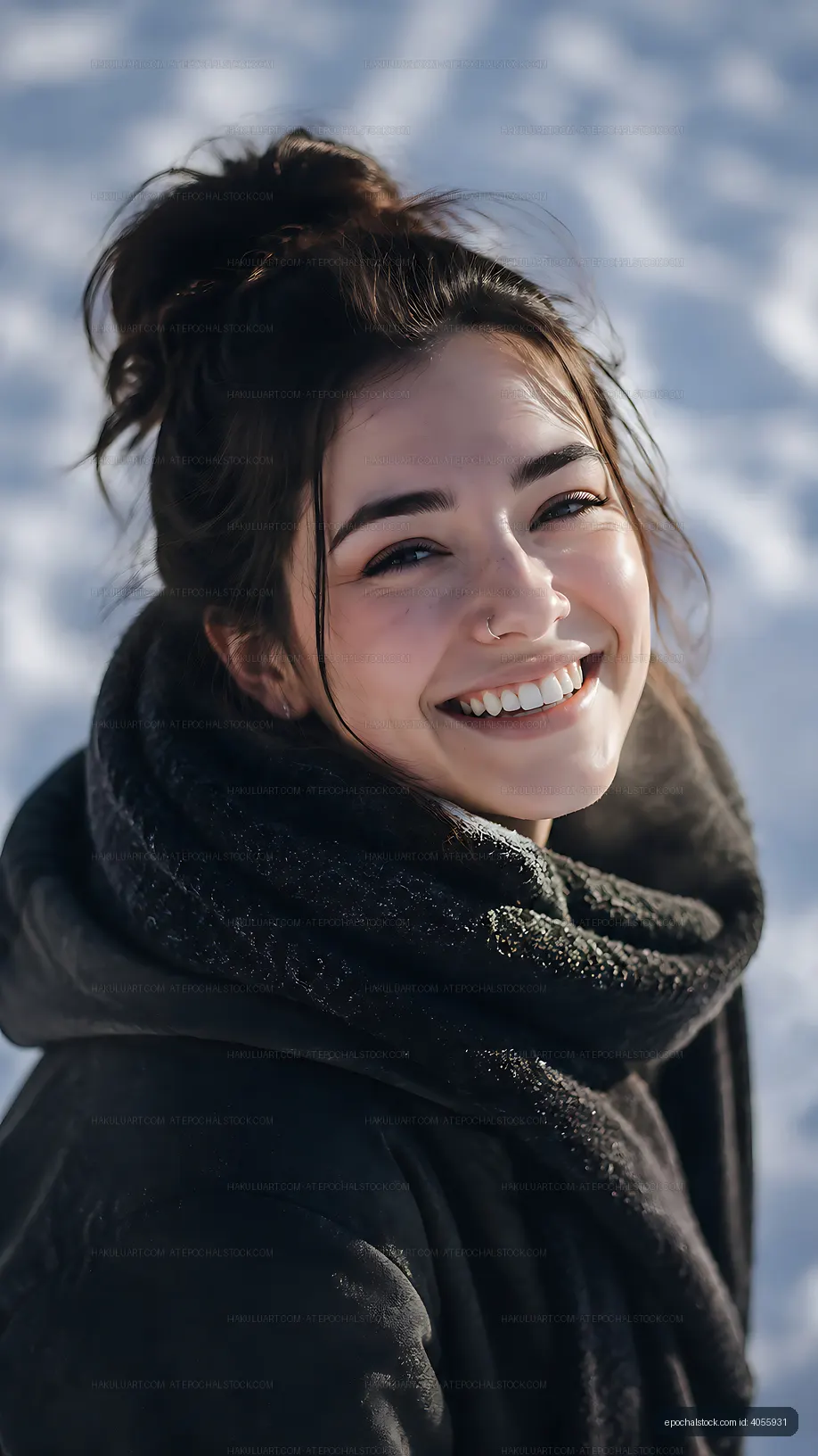 Woman smiling outdoors in winter with snow in the background
