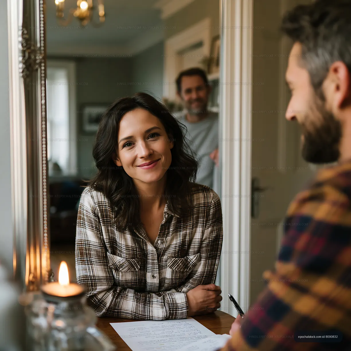 Couple discussing plans at home with relaxed smiles