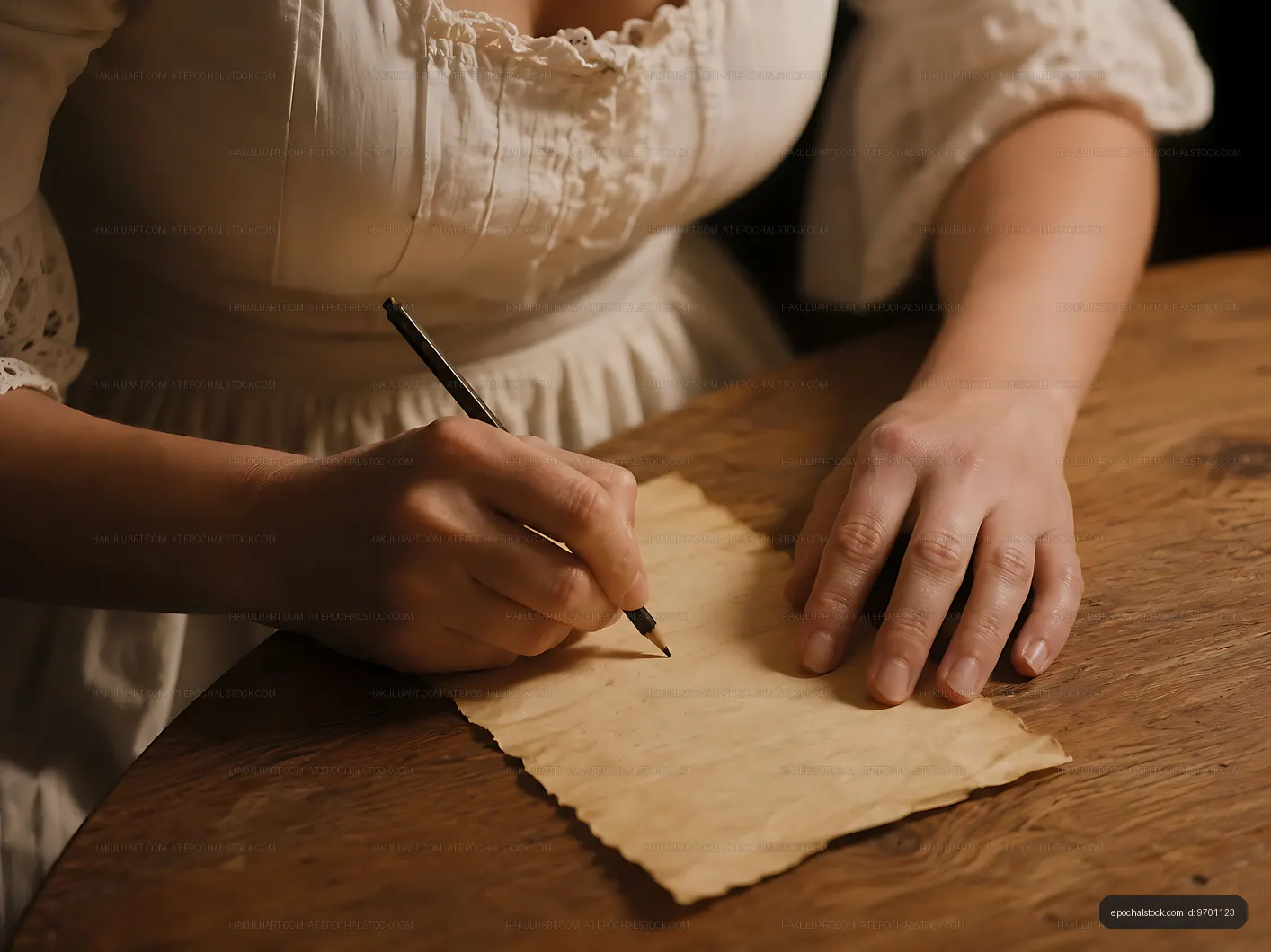 Writing a letter on vintage paper at a wooden table