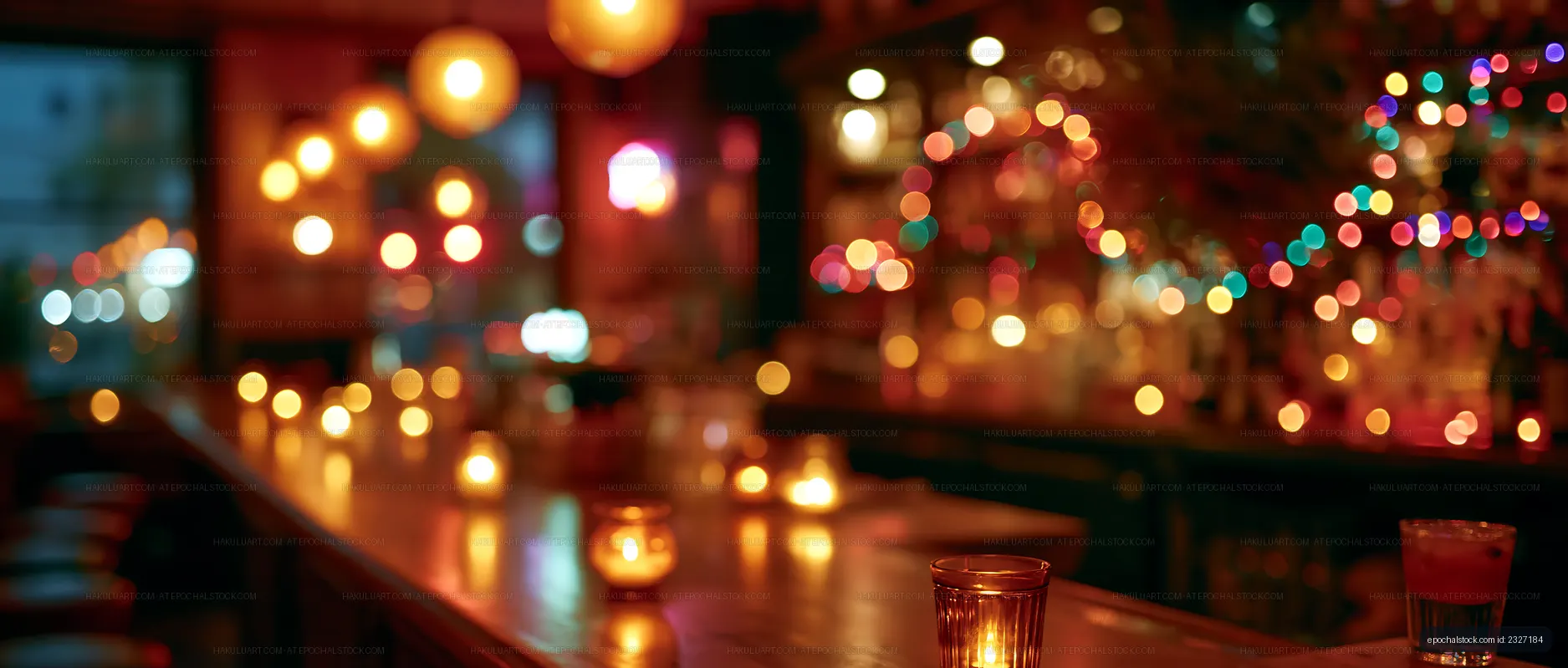 Evening bar scene with warm lights and drinks on the counter