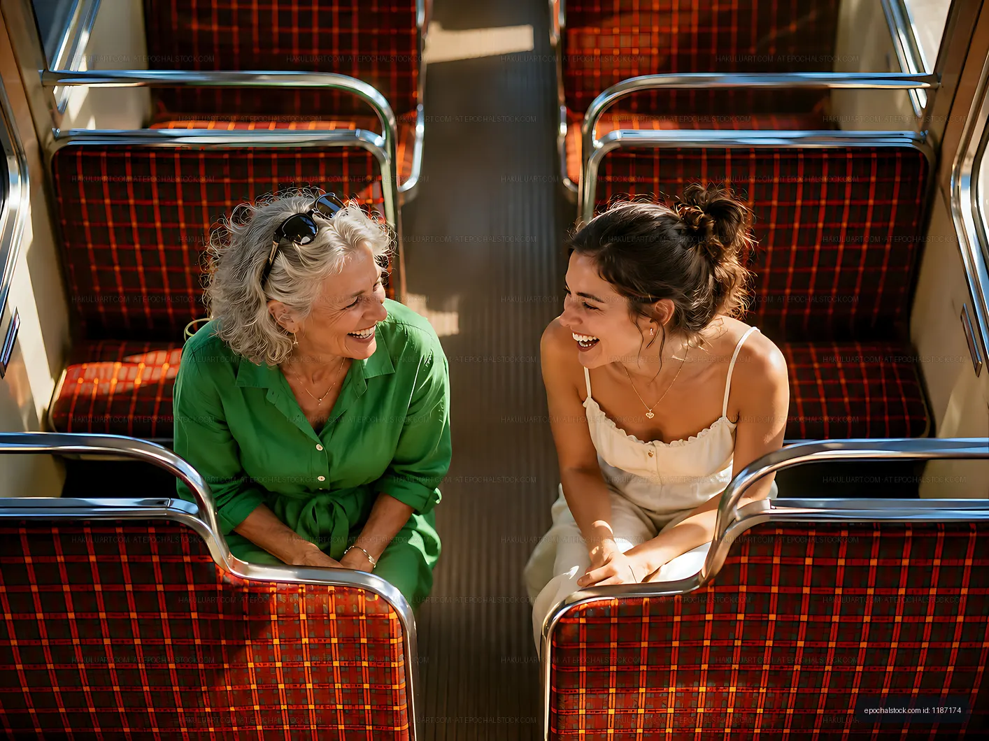 Women share laughter on a train journey