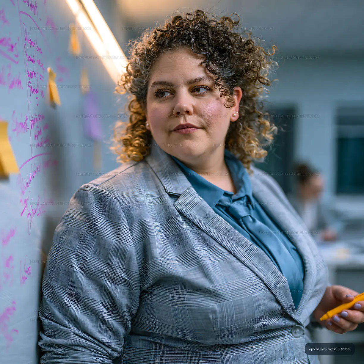 Businesswoman presents ideas in a meeting room with sticky notes