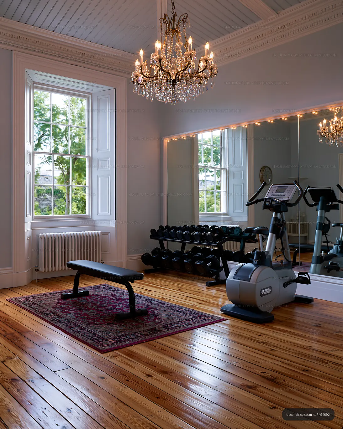 Home gym with exercise equipment and wooden flooring