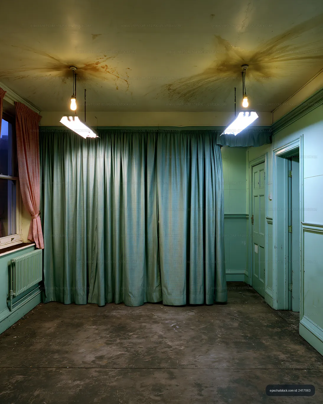 Empty room with green curtains and overhead lights