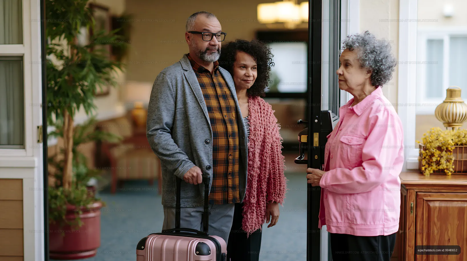 Family reunion at the door with luggage in a cozy setting