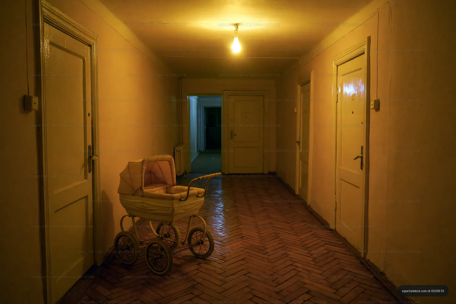 Empty hallway with a vintage baby stroller in a building