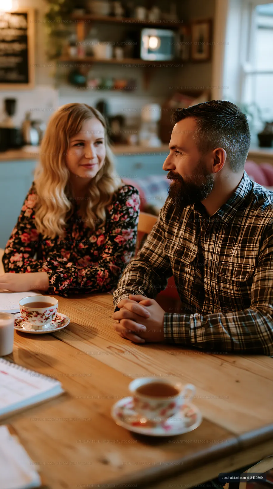 Couple having a conversation in a cozy kitchen setting