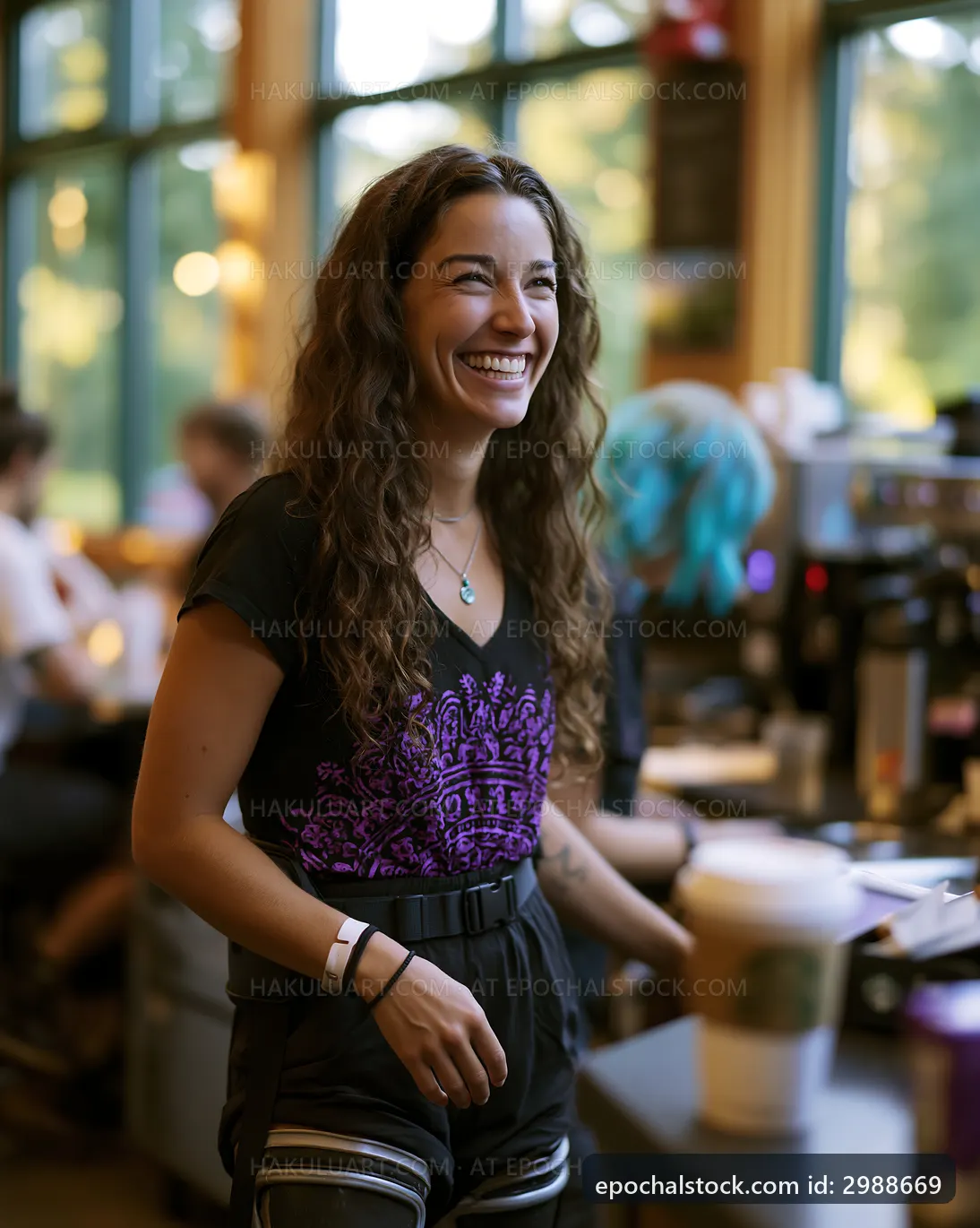 Woman smiling in cafe during busy day serving customers