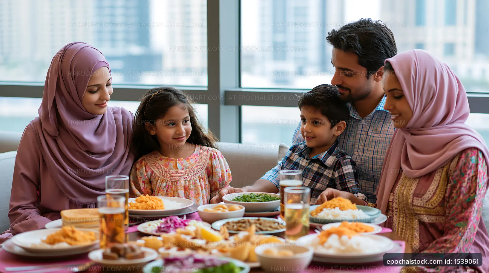 Family dining together with traditional food in modern setting