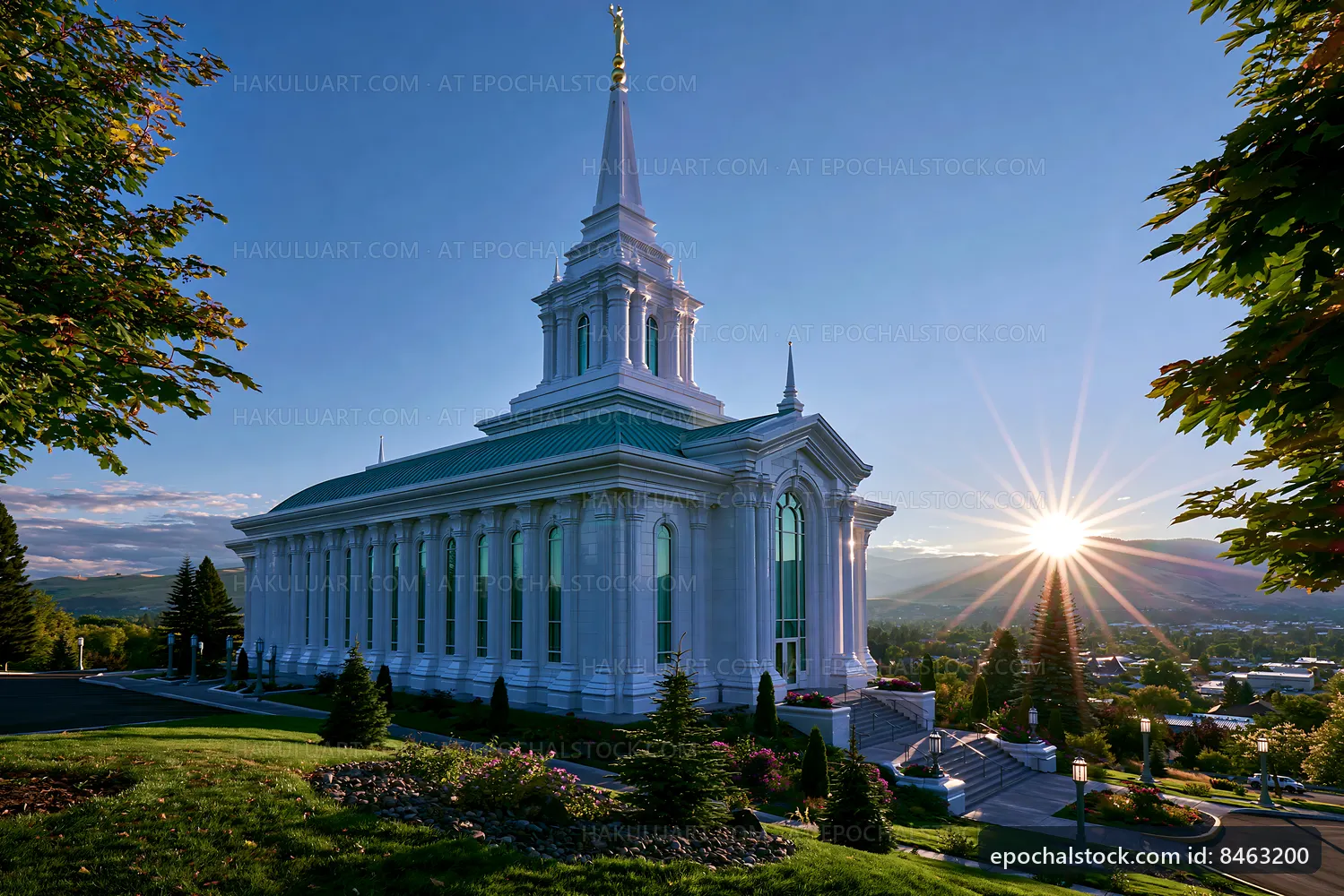 Sunrise over a large church building with a tall steeple