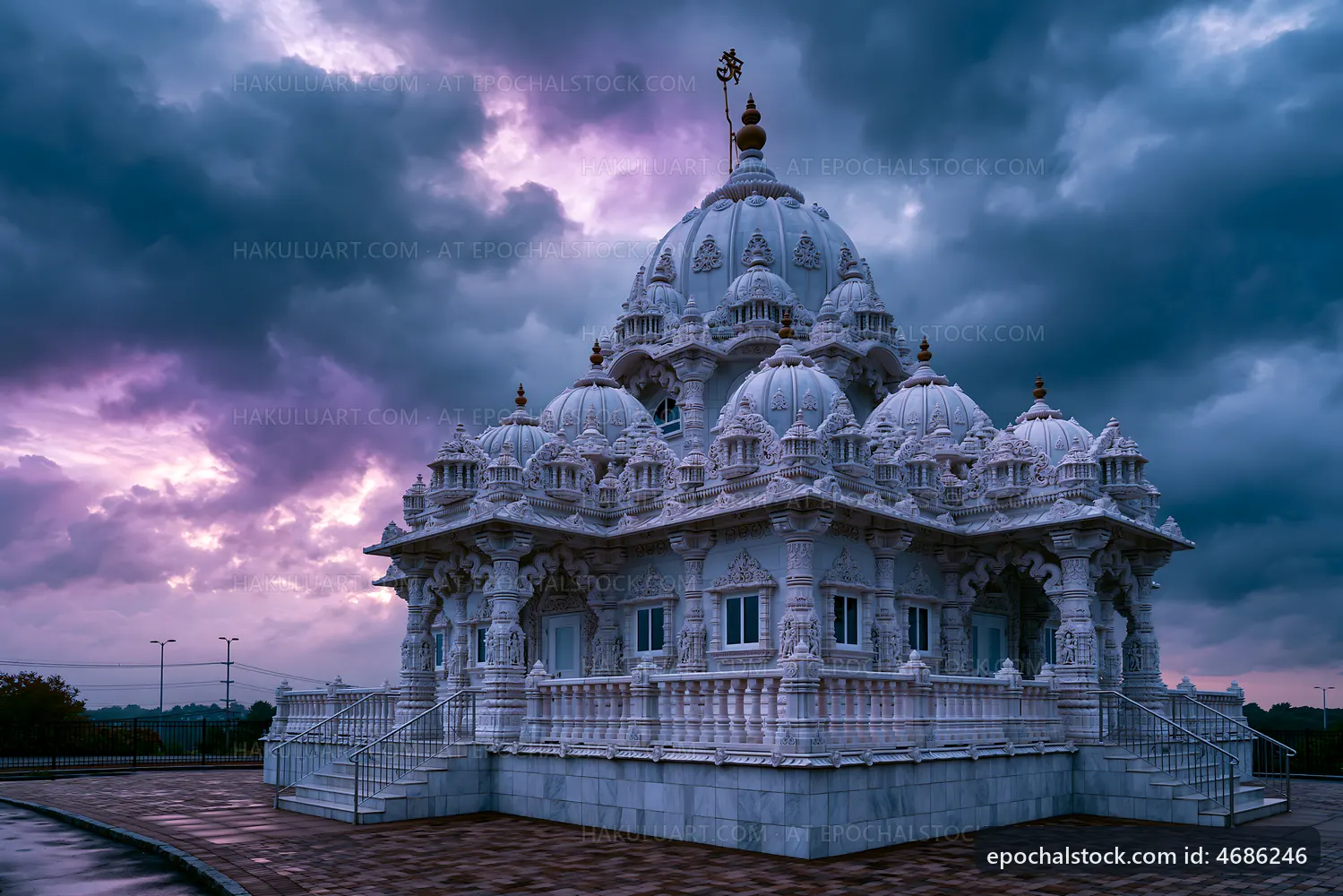 White temple under cloudy sky at sunset