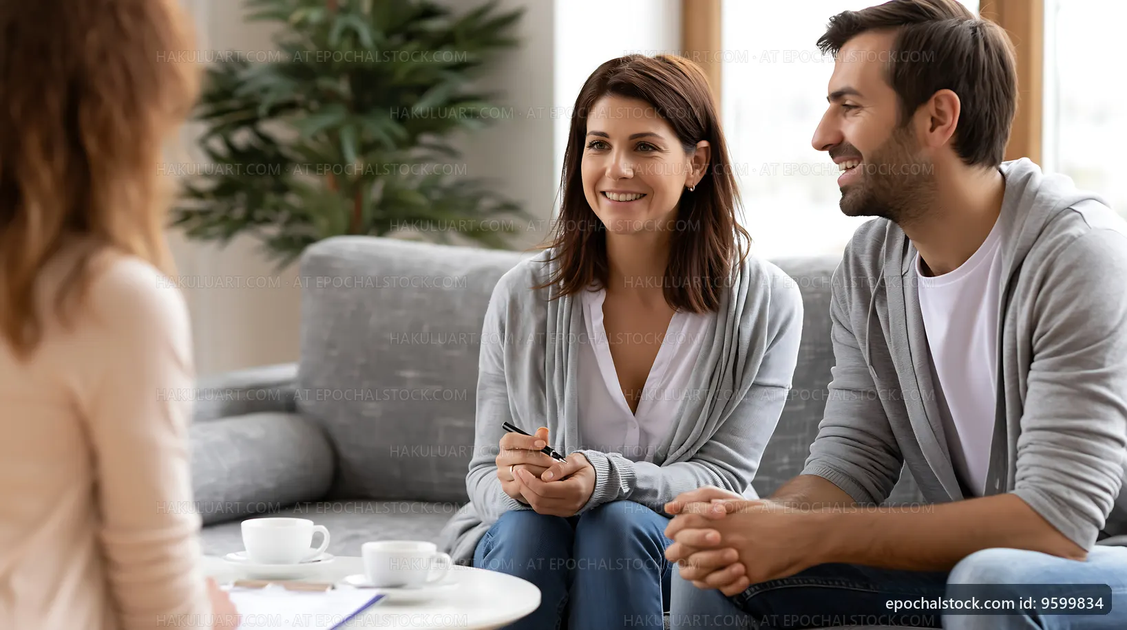 Couple discussing plans with a counselor in a cozy setting