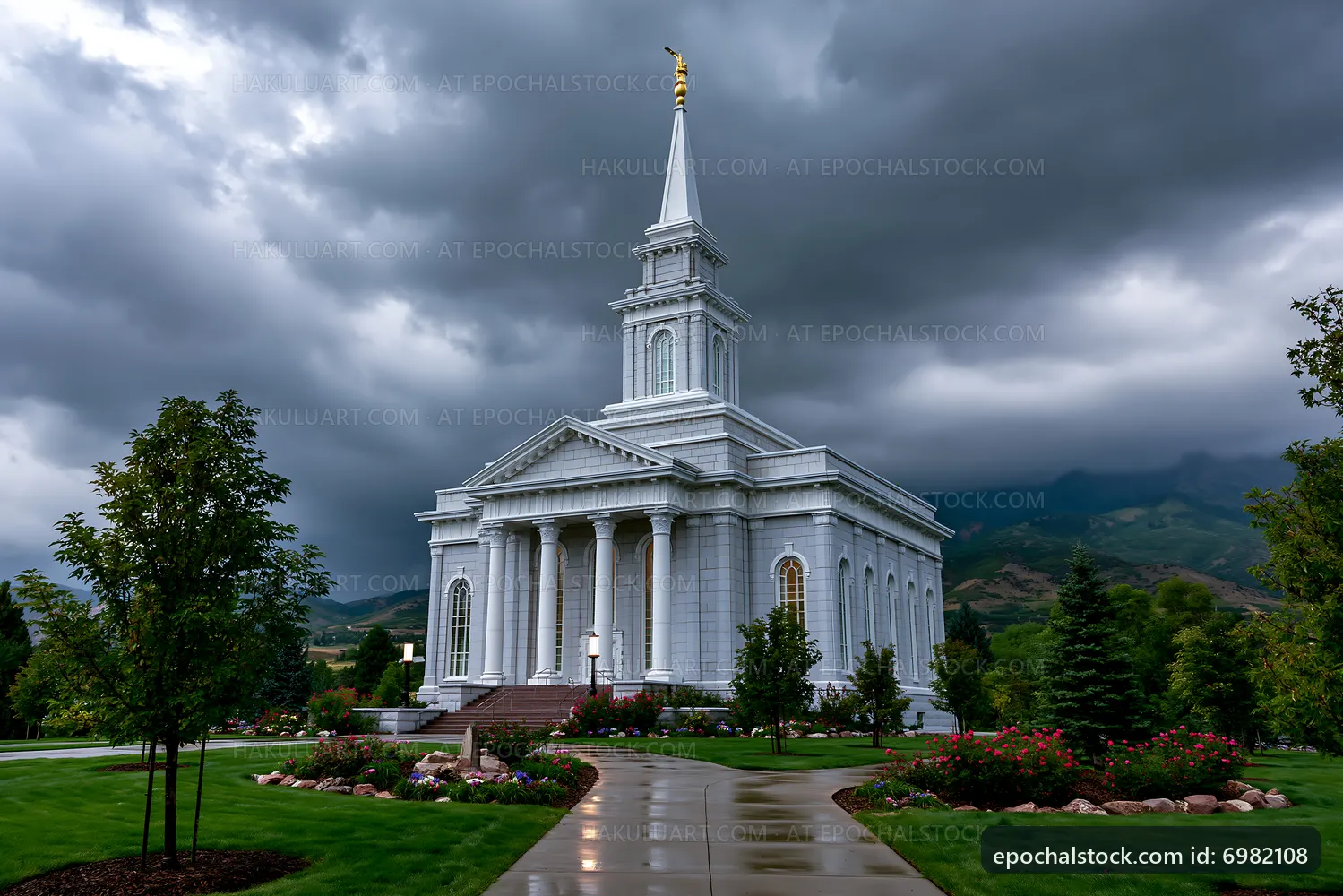Church building with tall spire under dark clouds in landscape