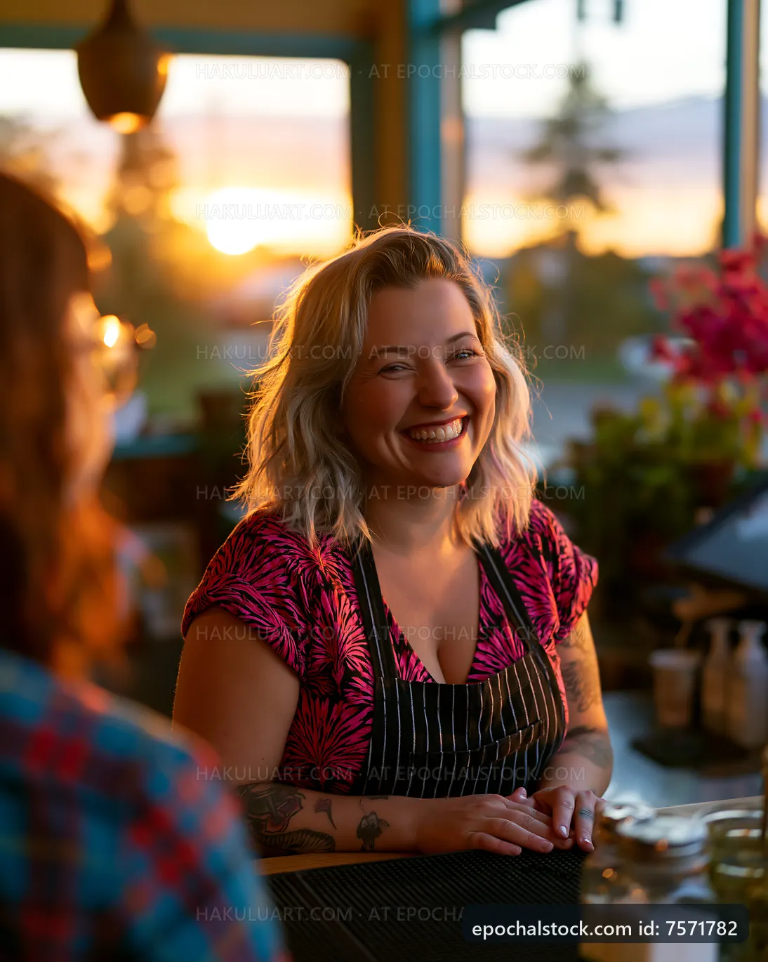 Smiling bartender in cafe during sunset hours