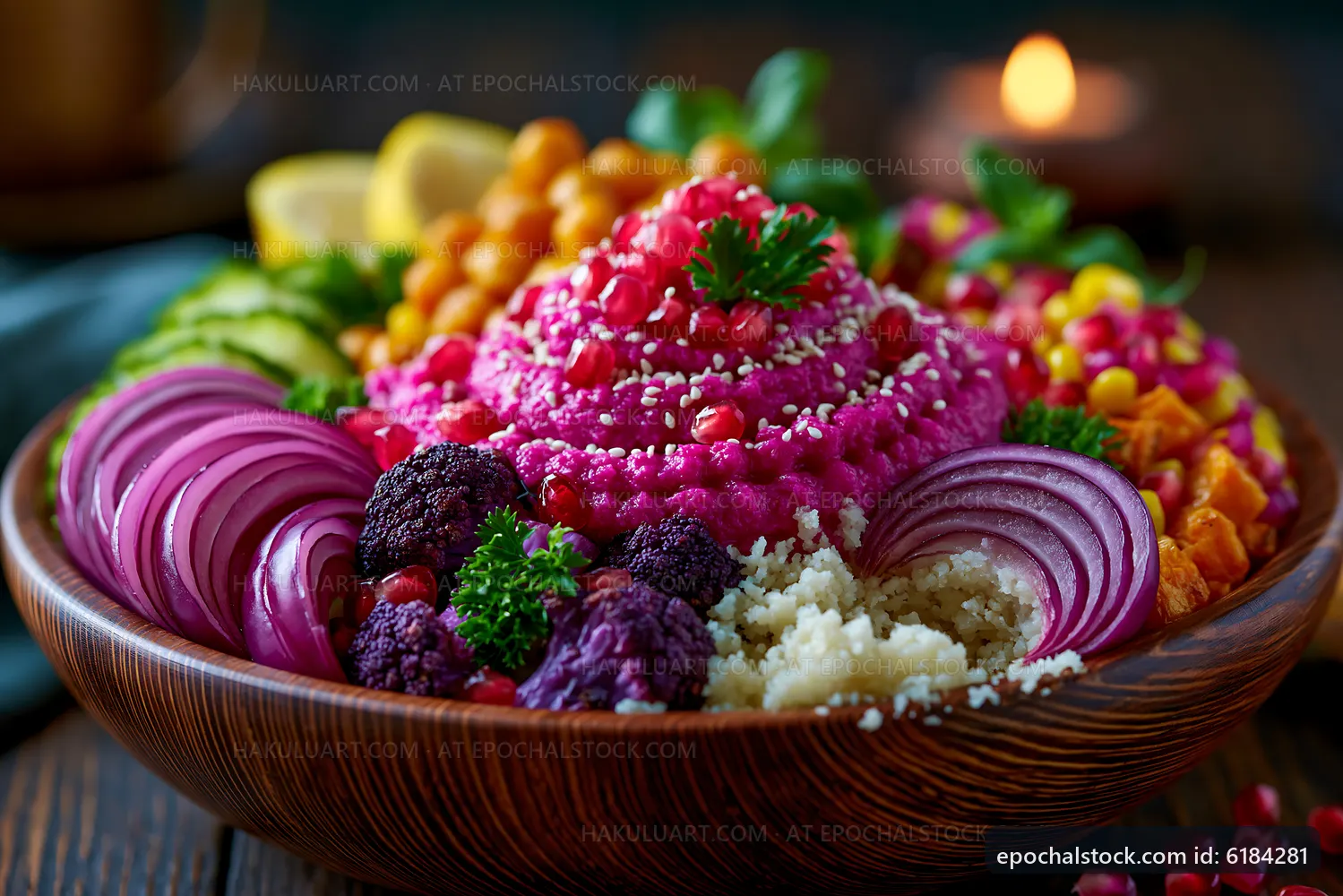 Colorful bowl of hummus with vegetables and toppings