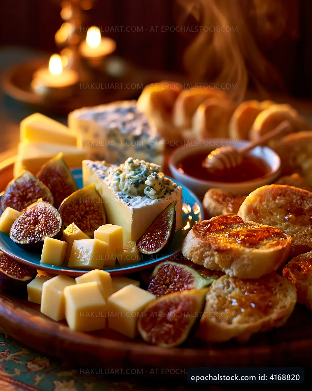 Cheese and fig platter with bread and honey on a wooden table