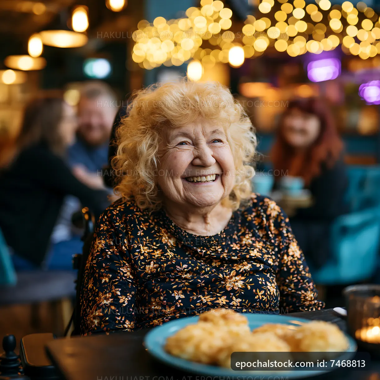 Elderly woman smiling in cafe with friends and food