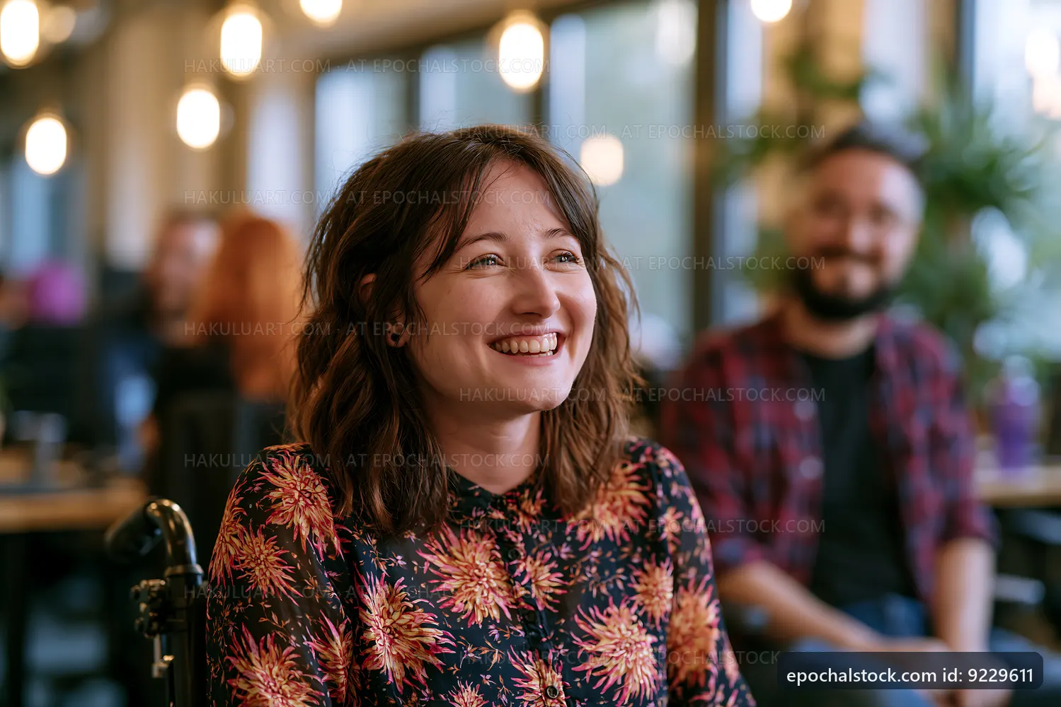 Woman smiling in cafe during social gathering with friends