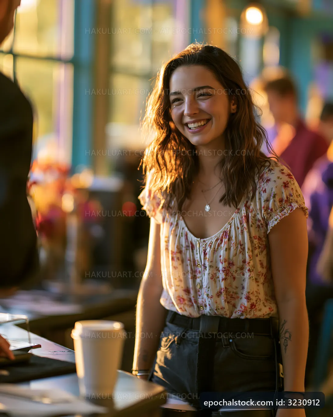 Young woman smiling at a cafe during daytime