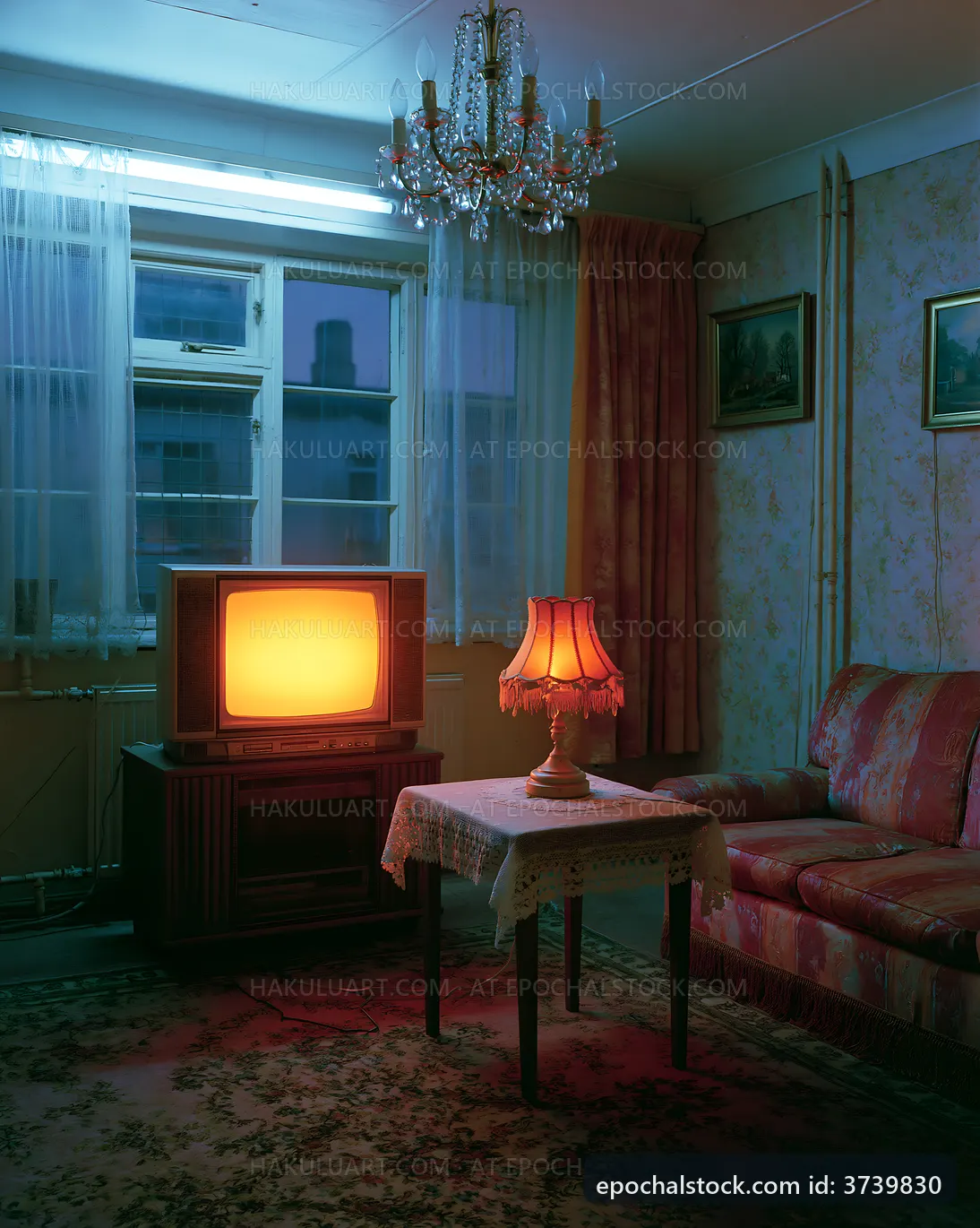 Living room with an old TV and lamp during evening light