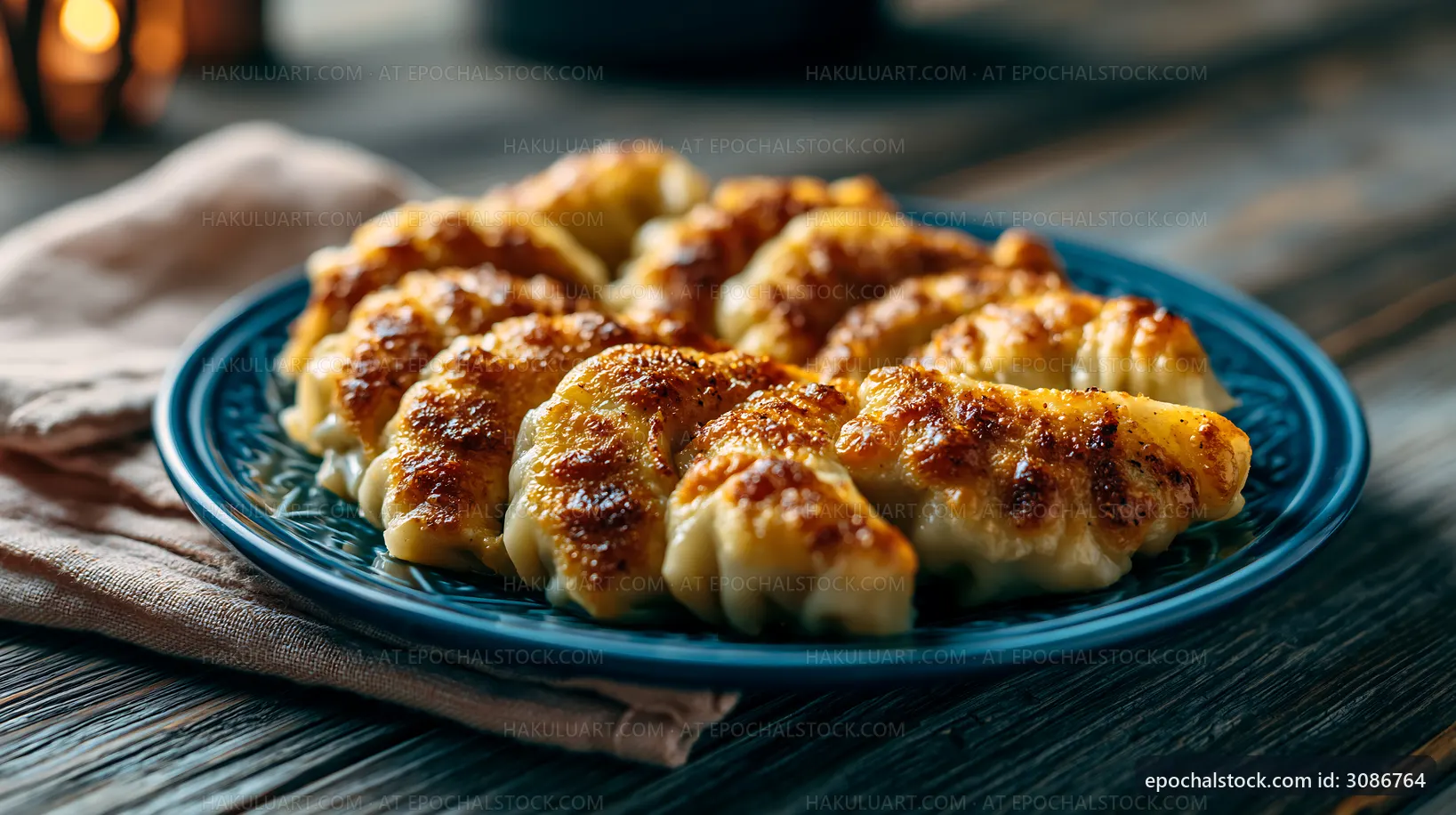 Delicious dumplings served on a blue plate with a rustic background