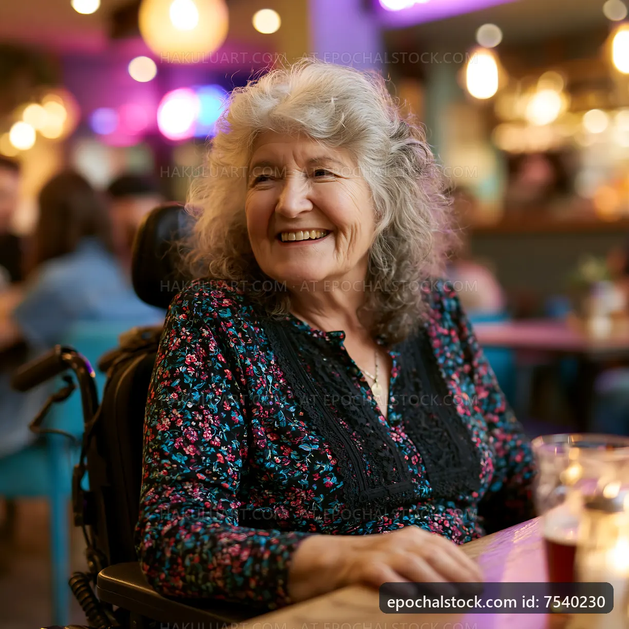 Smiling elderly woman in a wheelchair at a lively cafe