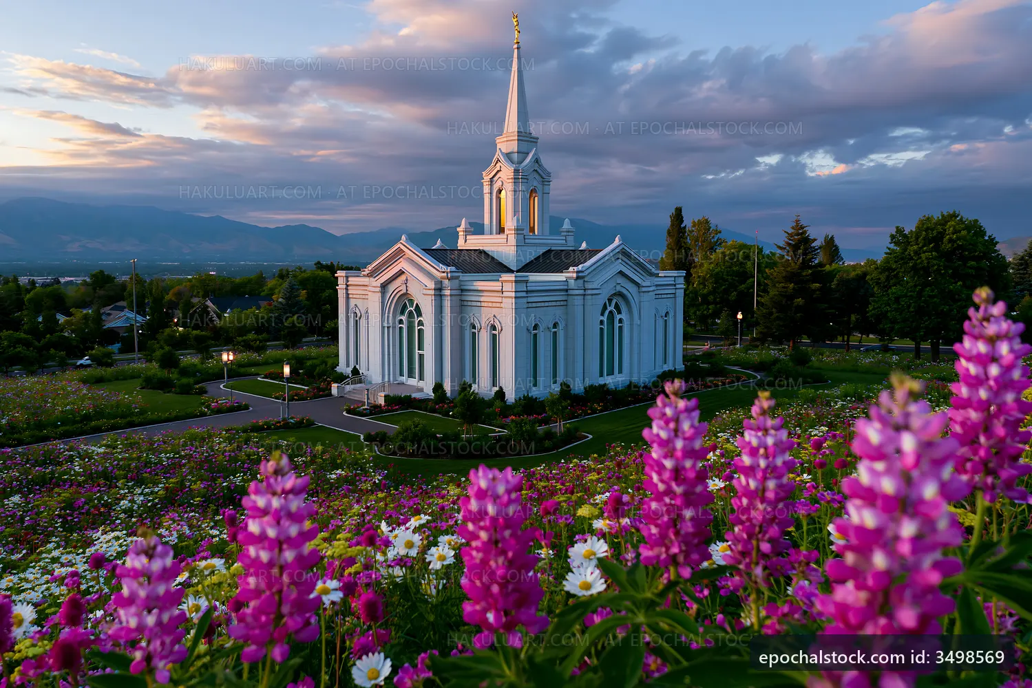 Church building surrounded by flowers in a garden