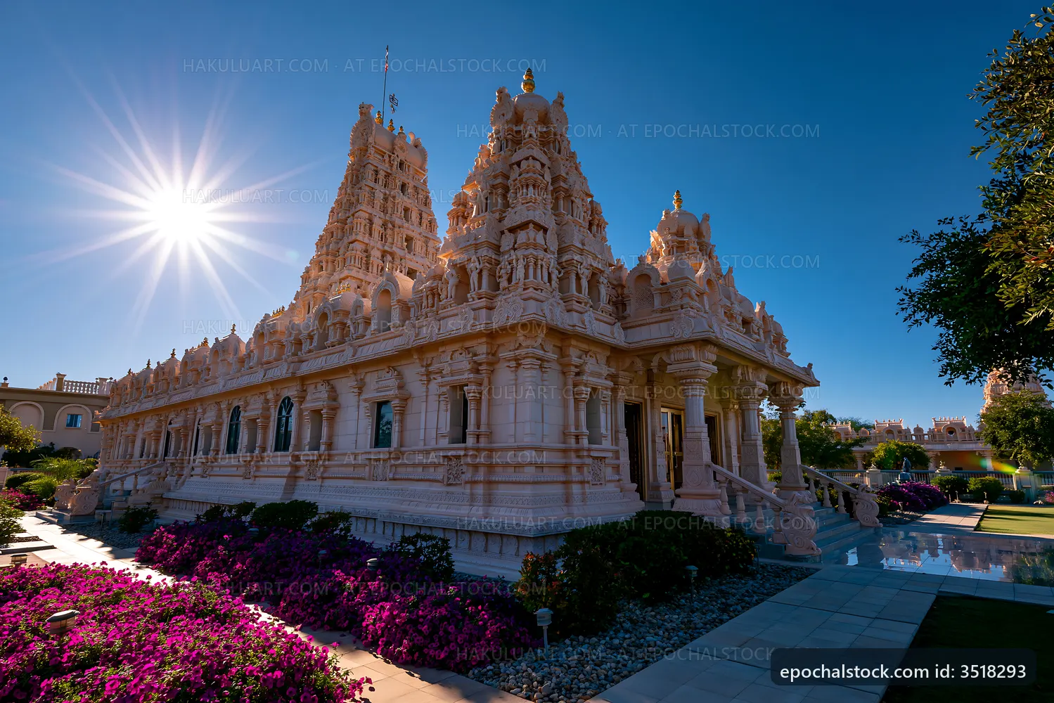 Temple surrounded by flowers and sunlight in clear sky