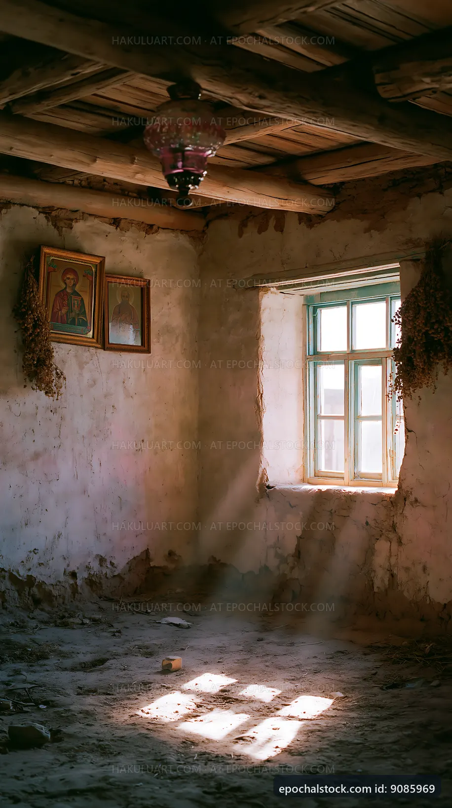 Old room with a window and hanging herbs in sunlight