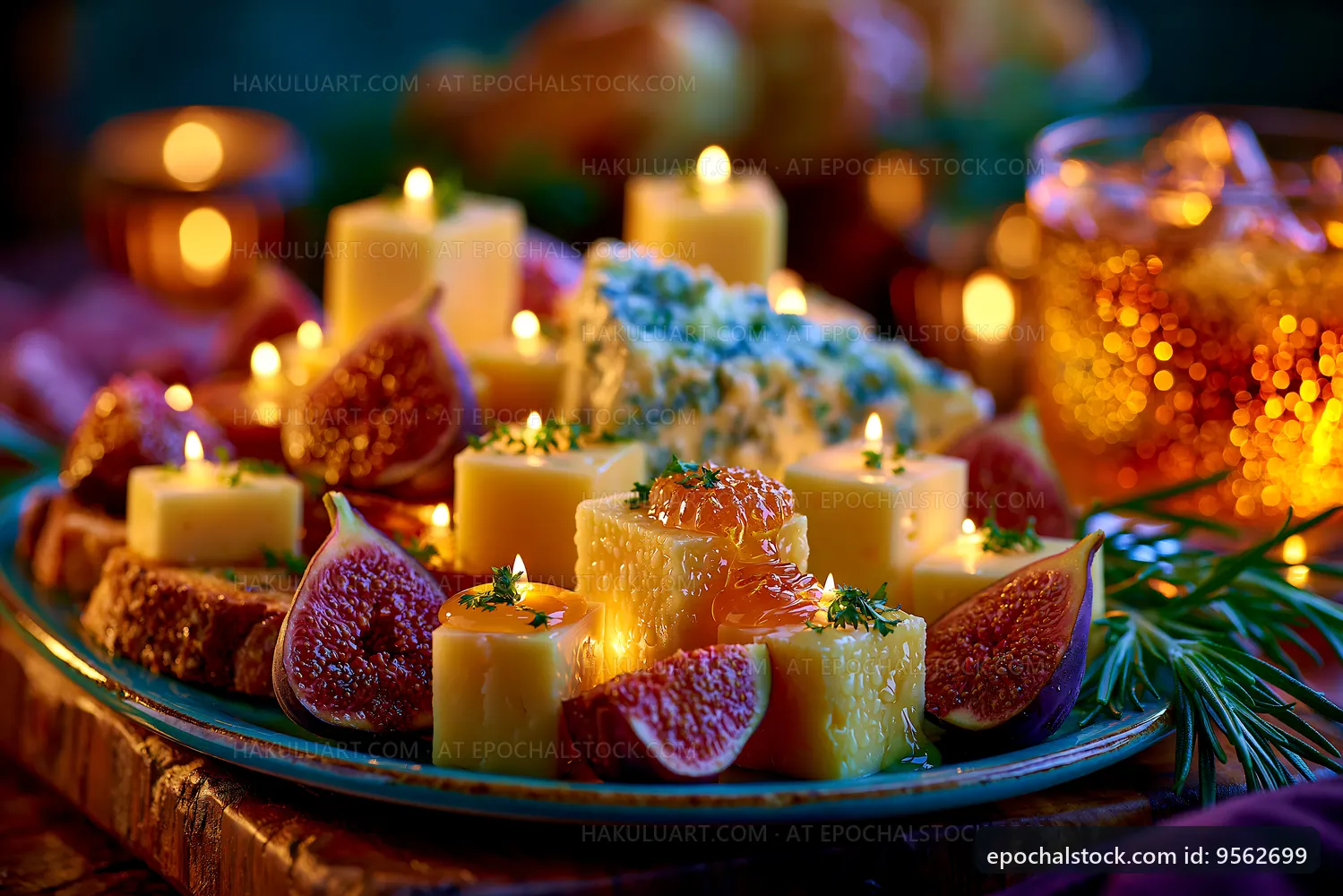 Cheese platter with figs and candles on a wooden table