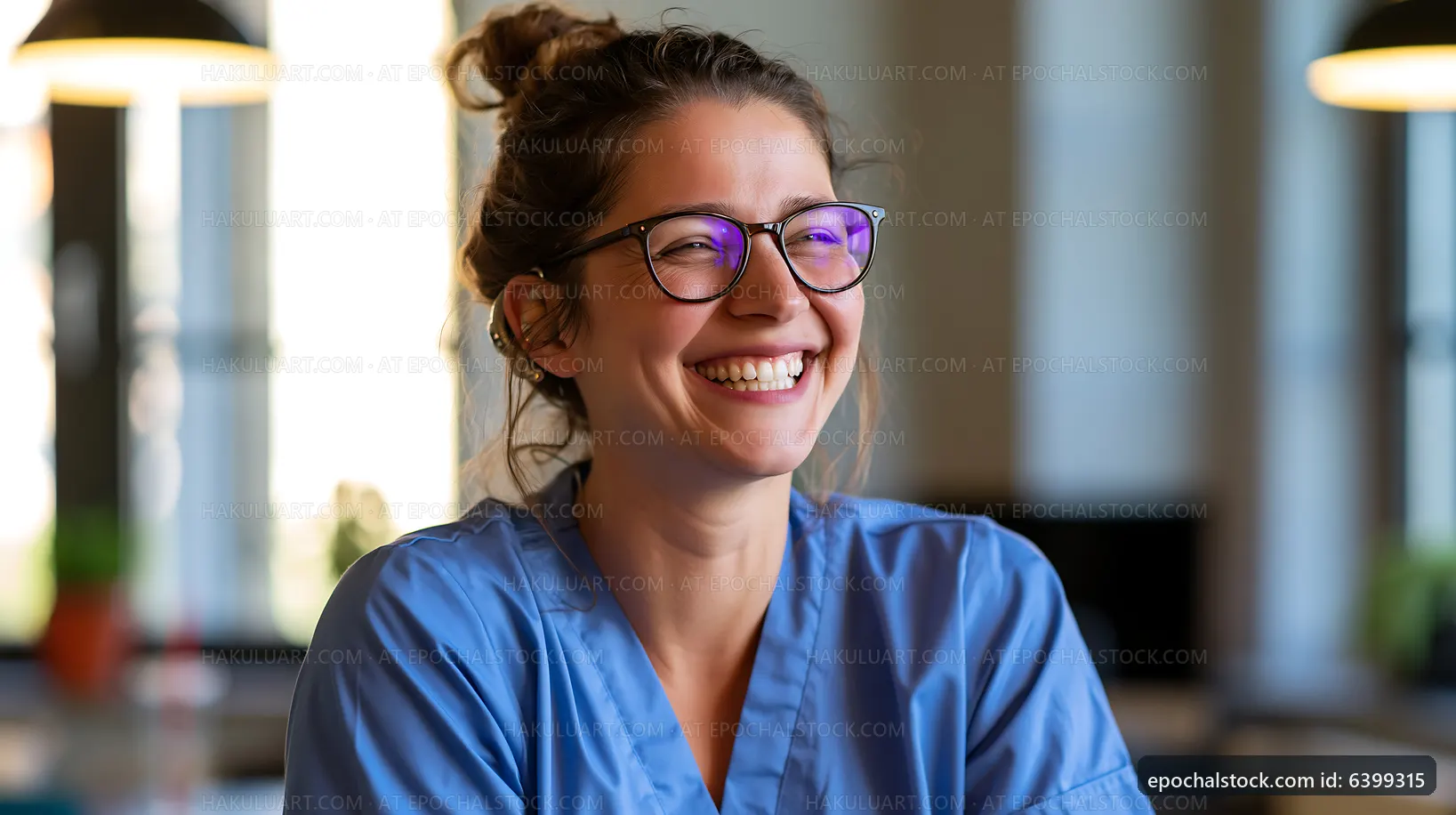 Young woman with glasses smiling in clinic setting