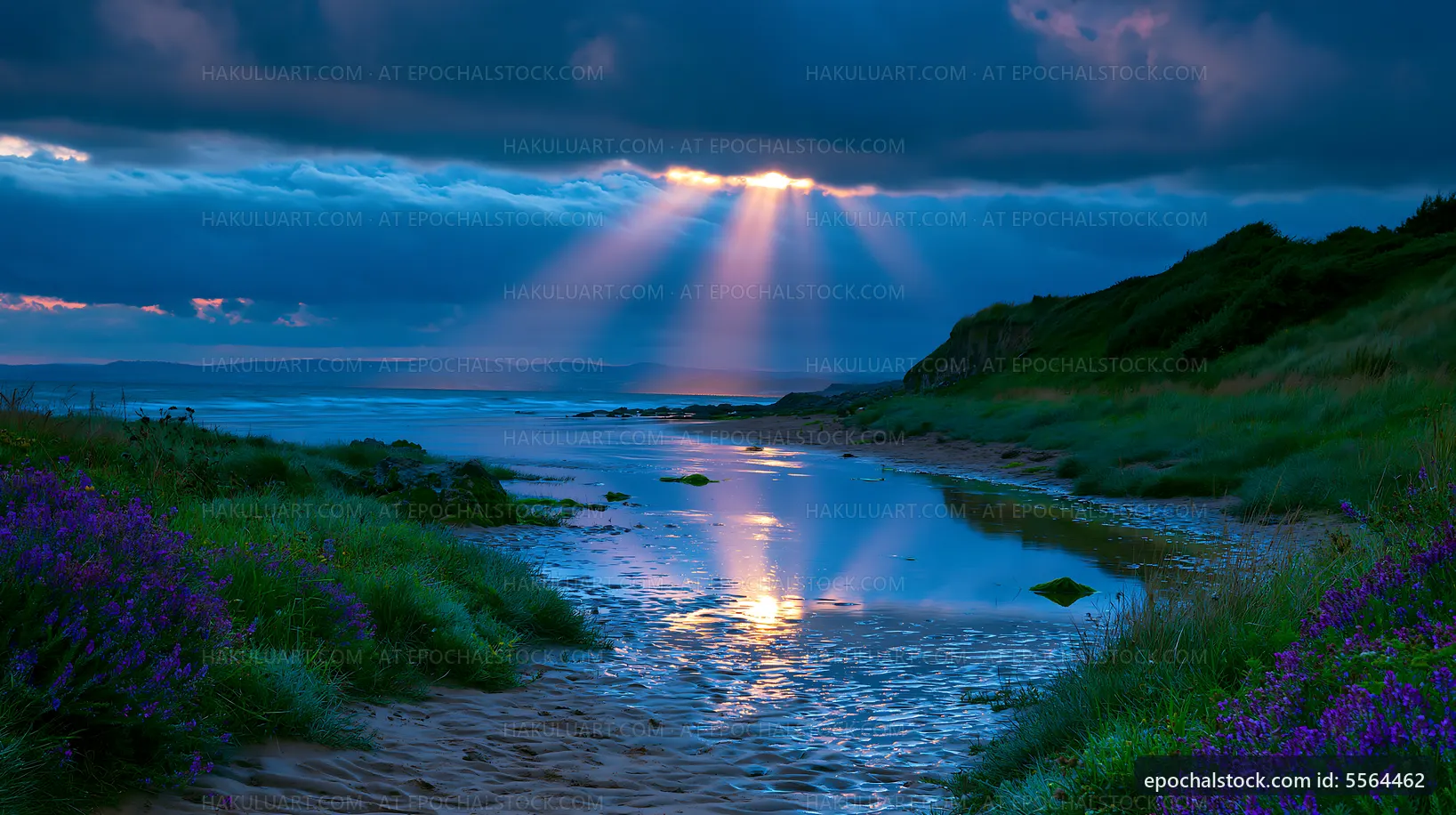 Sunlight breaks through clouds over a beach at dawn