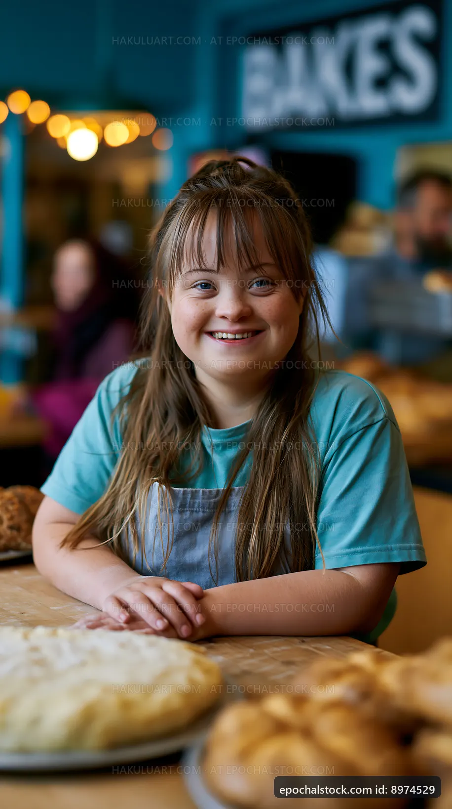 Girl smiling in a bakery, enjoying a day helping with baking