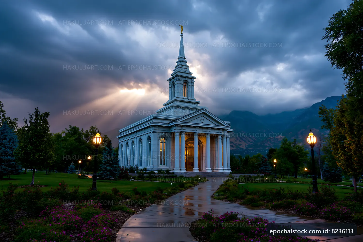 Cloudy sky above a church with mountains in the background