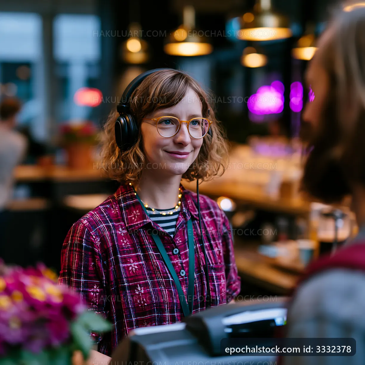 Barista serving coffee in a cozy café setting