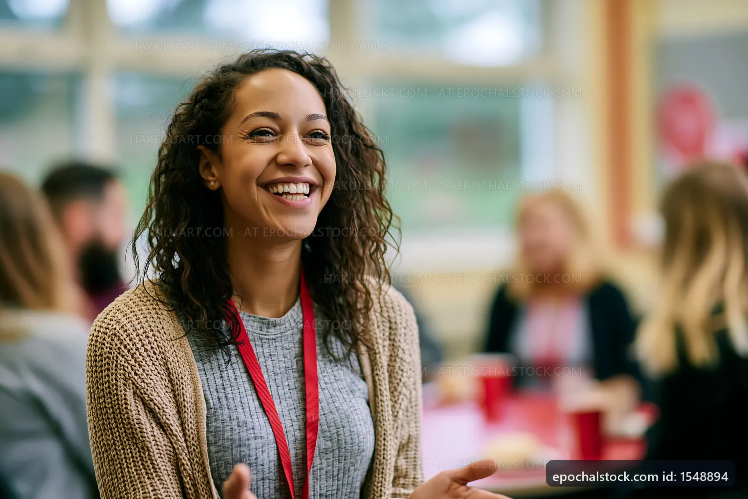 Smiling woman at gathering with friends in casual setting