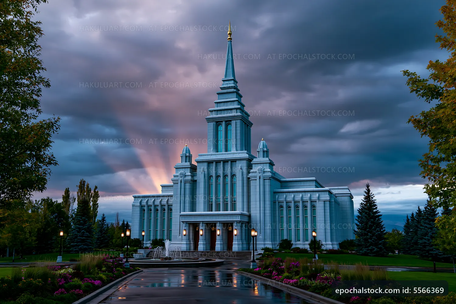 Bright rays behind the tall church building in cloudy sky