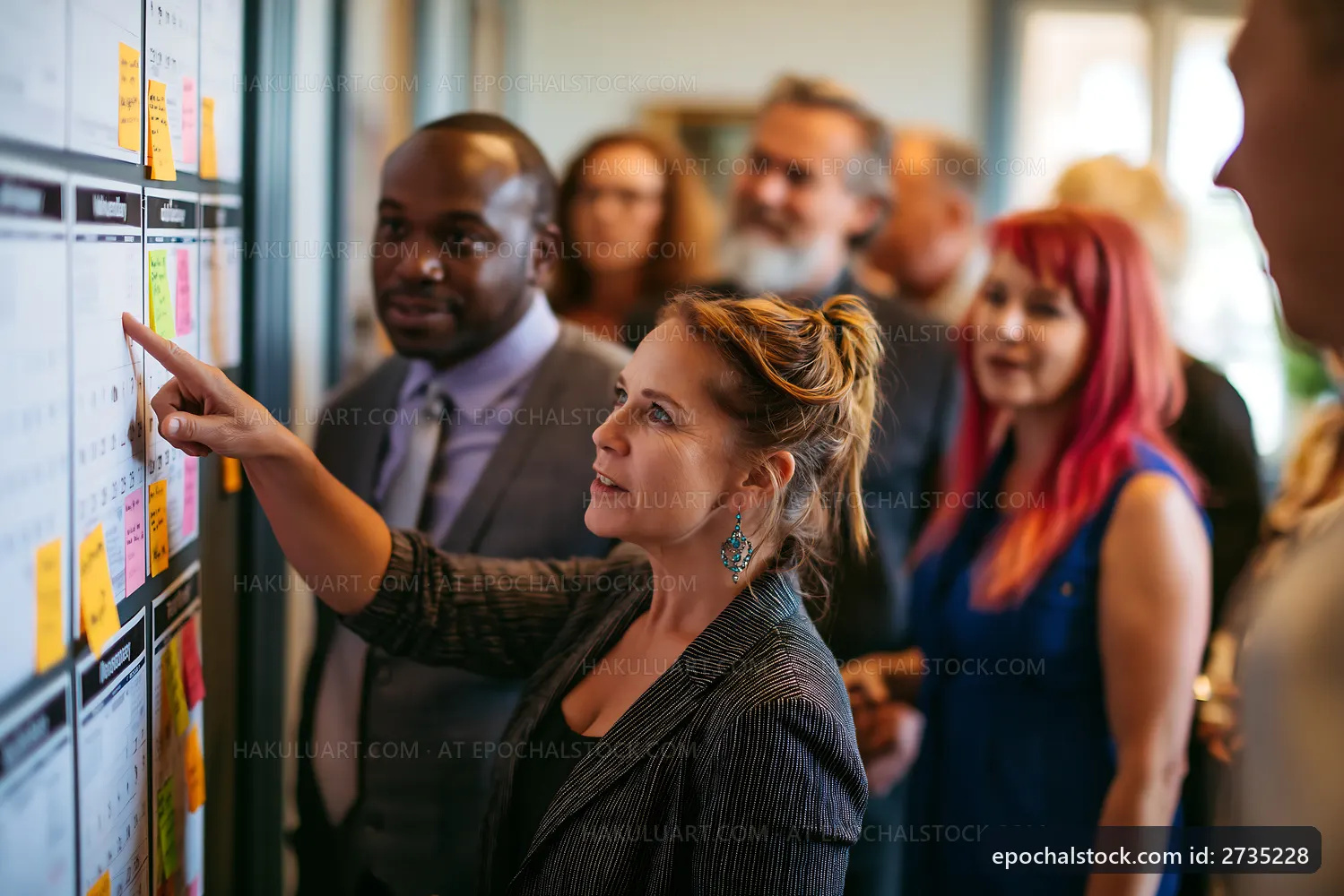 Business team discussing project ideas in office setting