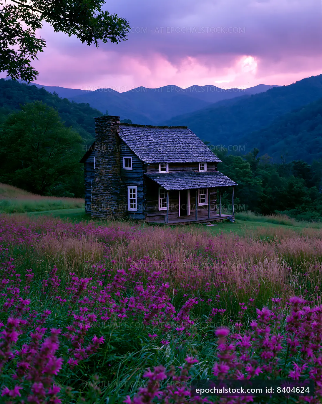 Mountain cabin surrounded by wildflowers at sunset