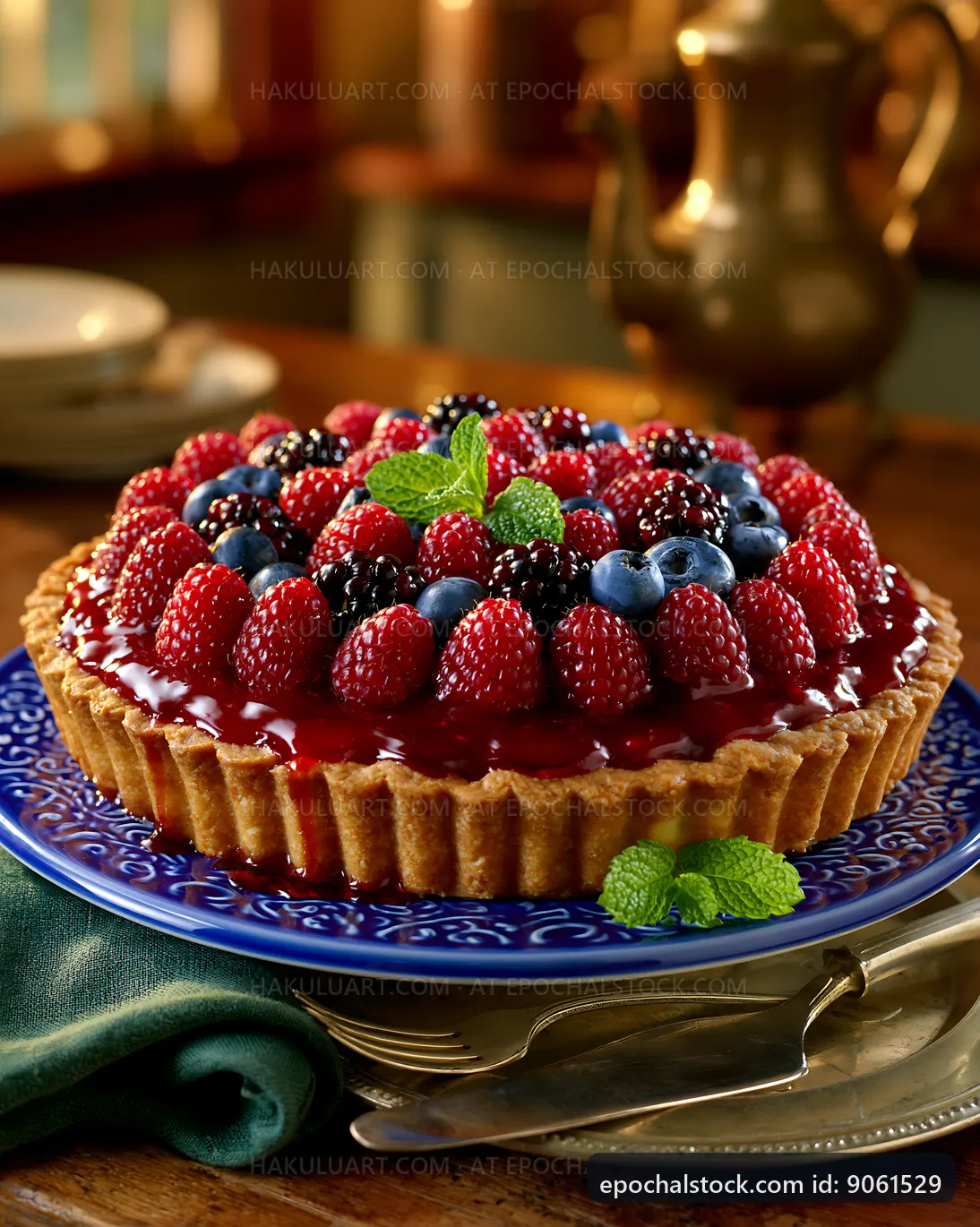 Berry tart with fresh fruits on display at a wooden table