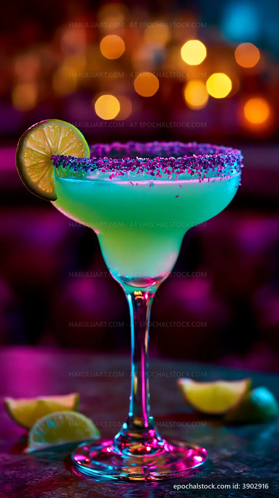 Colorful cocktail with lime slice on a bar table