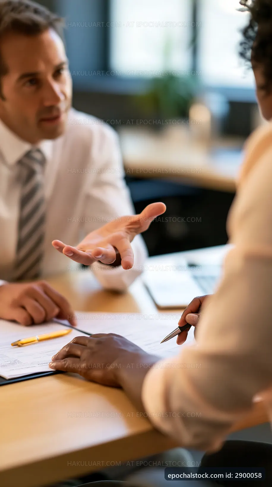 Business meeting in office with discussions and note-taking