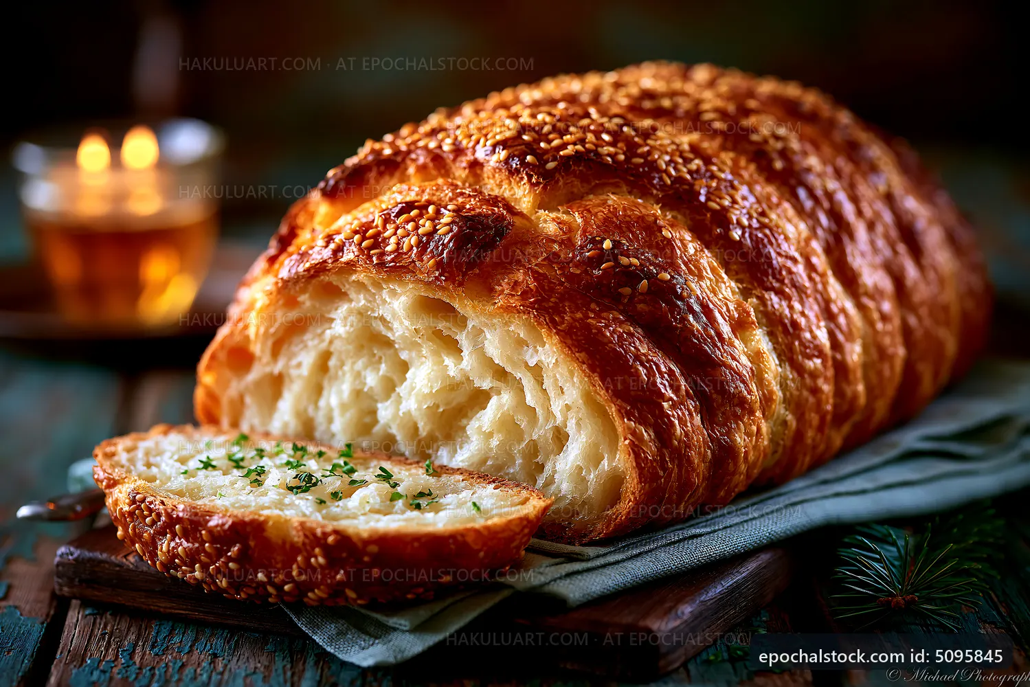 Freshly baked sesame bread on wooden table