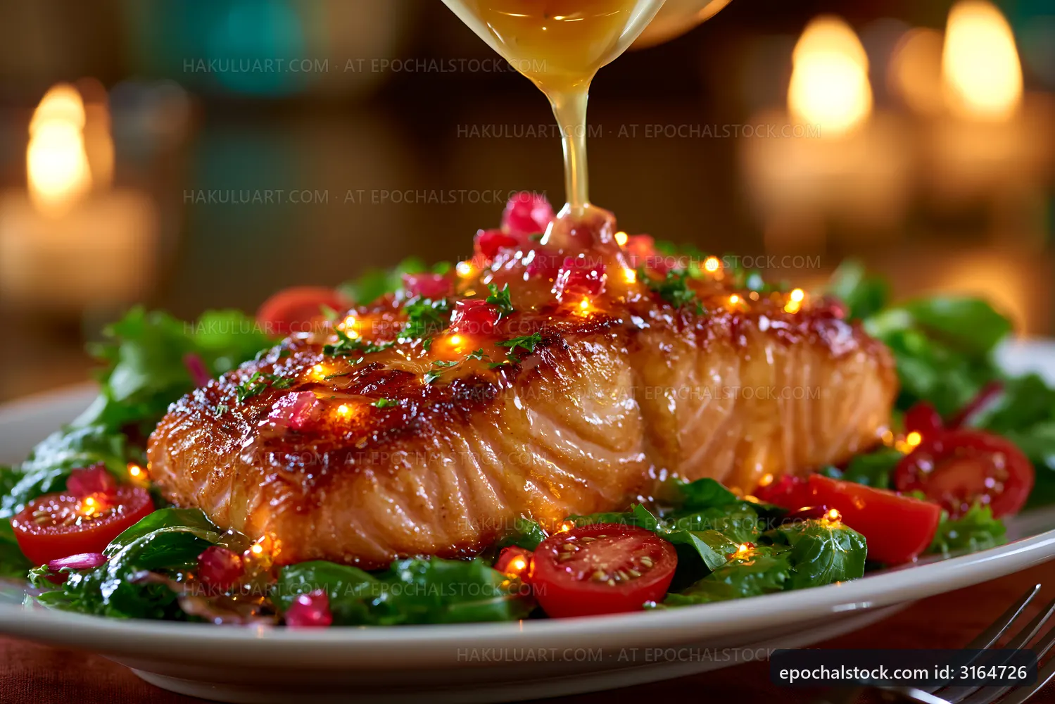 Salmon fillet served with salad and drizzled with sauce